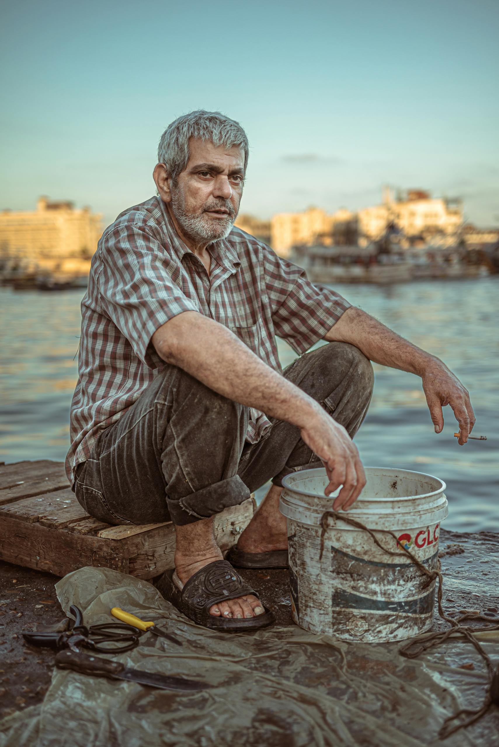 fisherman sitting on the pear